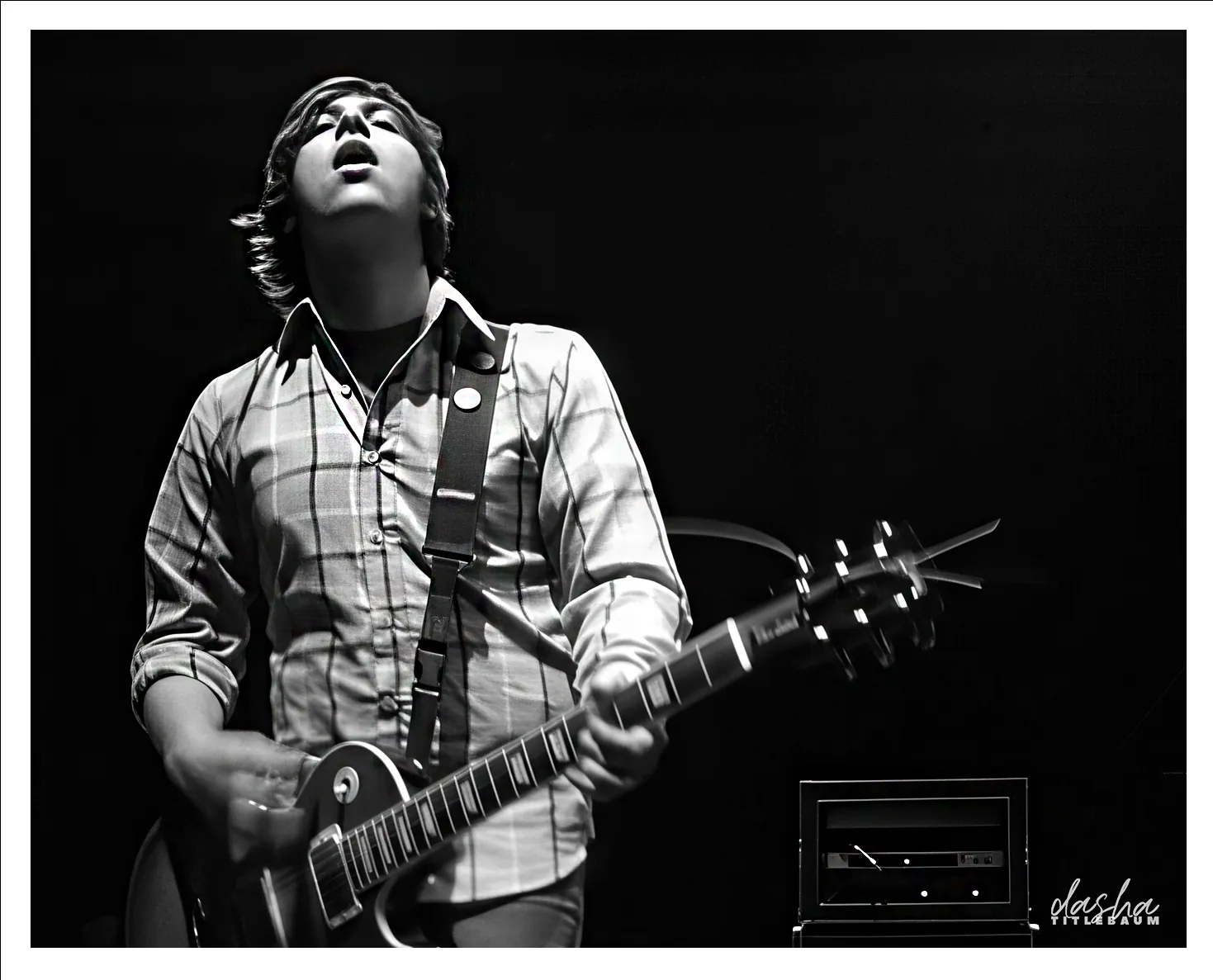 The Reunion Show, Stage-side frame of a reunion set, balancing colored backlight against performer detail.