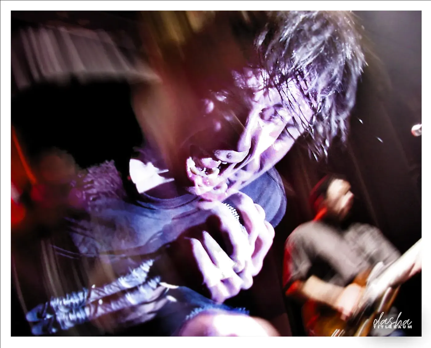 Thursday, Vocalist leaning into the crowd during a peak moment of the set.